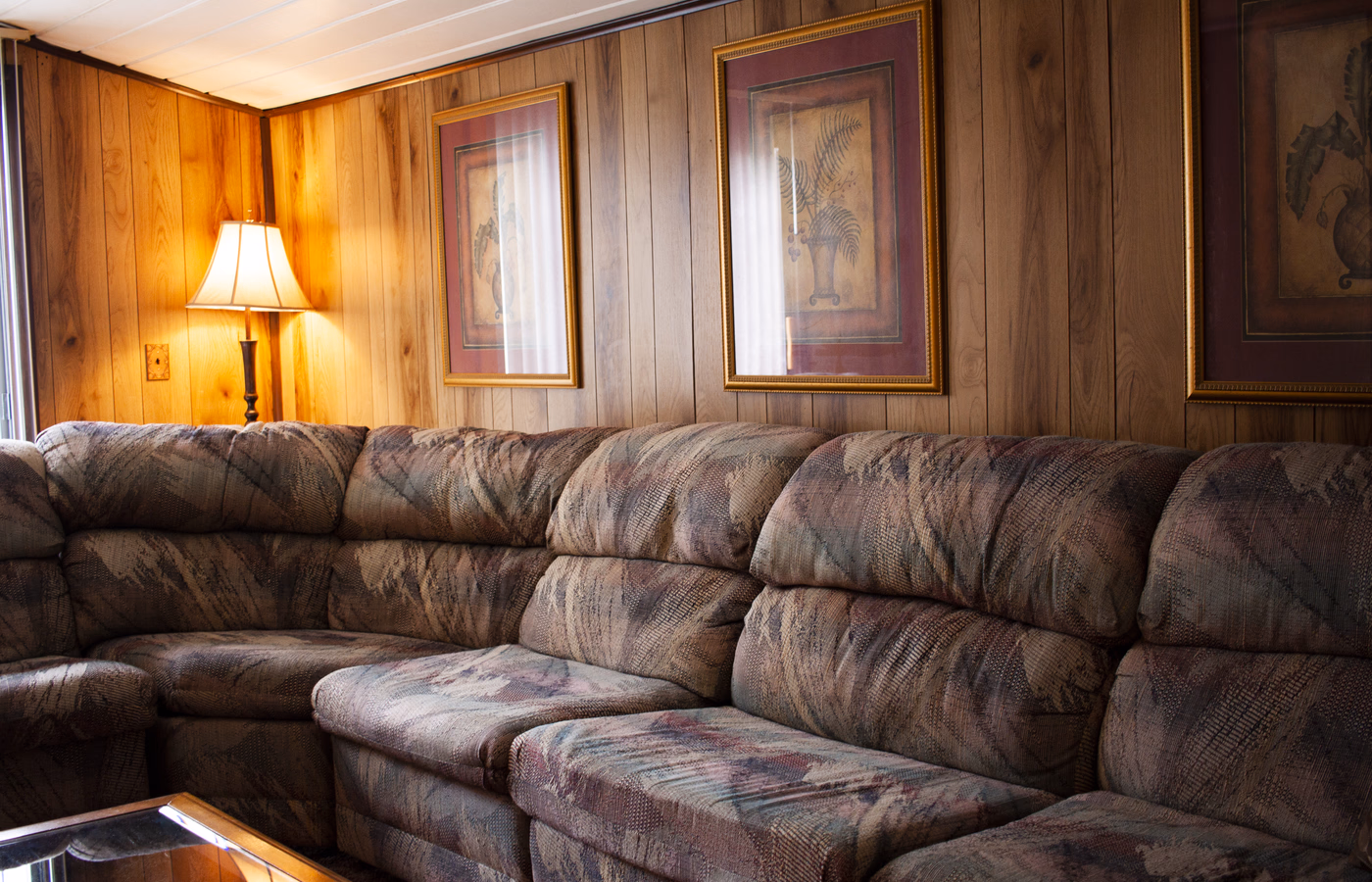 Wood-paneled common room in a real Parkersburg SILK Homes property