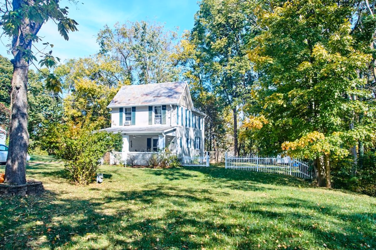 Historic home and garden grounds at a real SILK Homes property