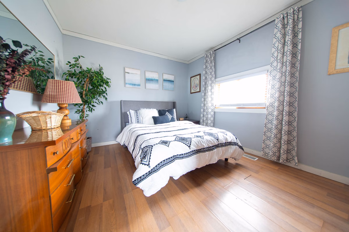 Bright furnished bedroom inside a current SILK Homes cottage