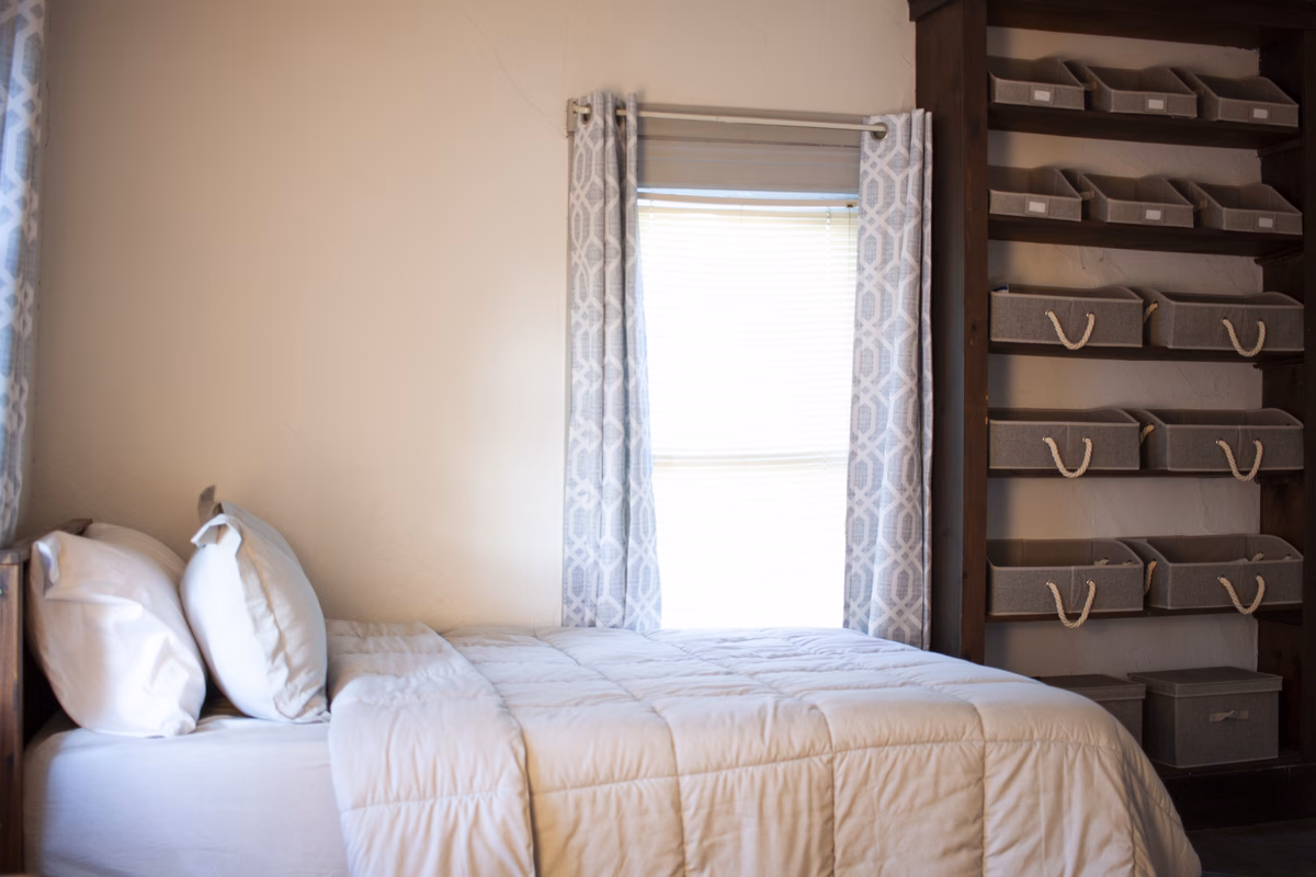 Current furnished bedroom with storage in a real Ravenswood SILK Homes property